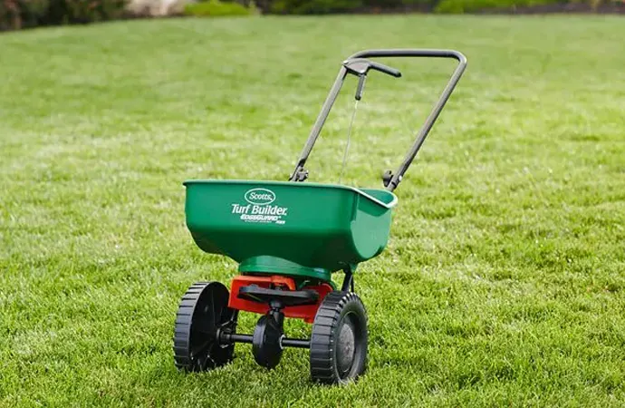 Lawn Spreader Too much fertilizer applied on one spot can kill grass.